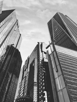 Striking black and white cityscape featuring towering skyscrapers and modern architecture.