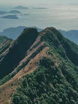 Aerial view of Lantau mountain in Hong Kong, showcasing serene landscapes and the South China Sea.