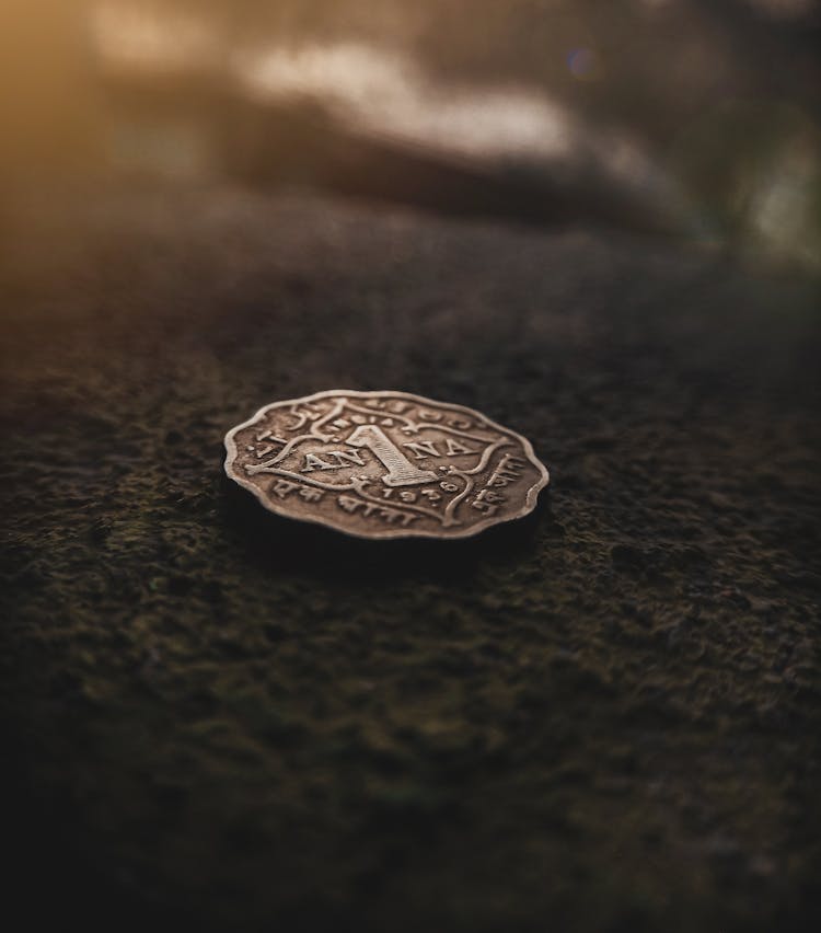 A Silver Coin On The Ground