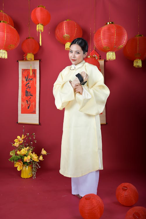 Woman Standing Beside Red Lanterns