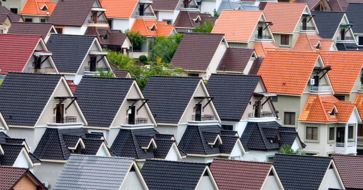 A vivid array of suburban rooftops showcasing diverse colors and architectural designs.