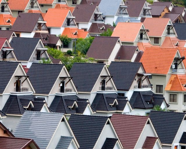Varied neighborhood rooftops Rows of suburban rooftops in different colors and styles