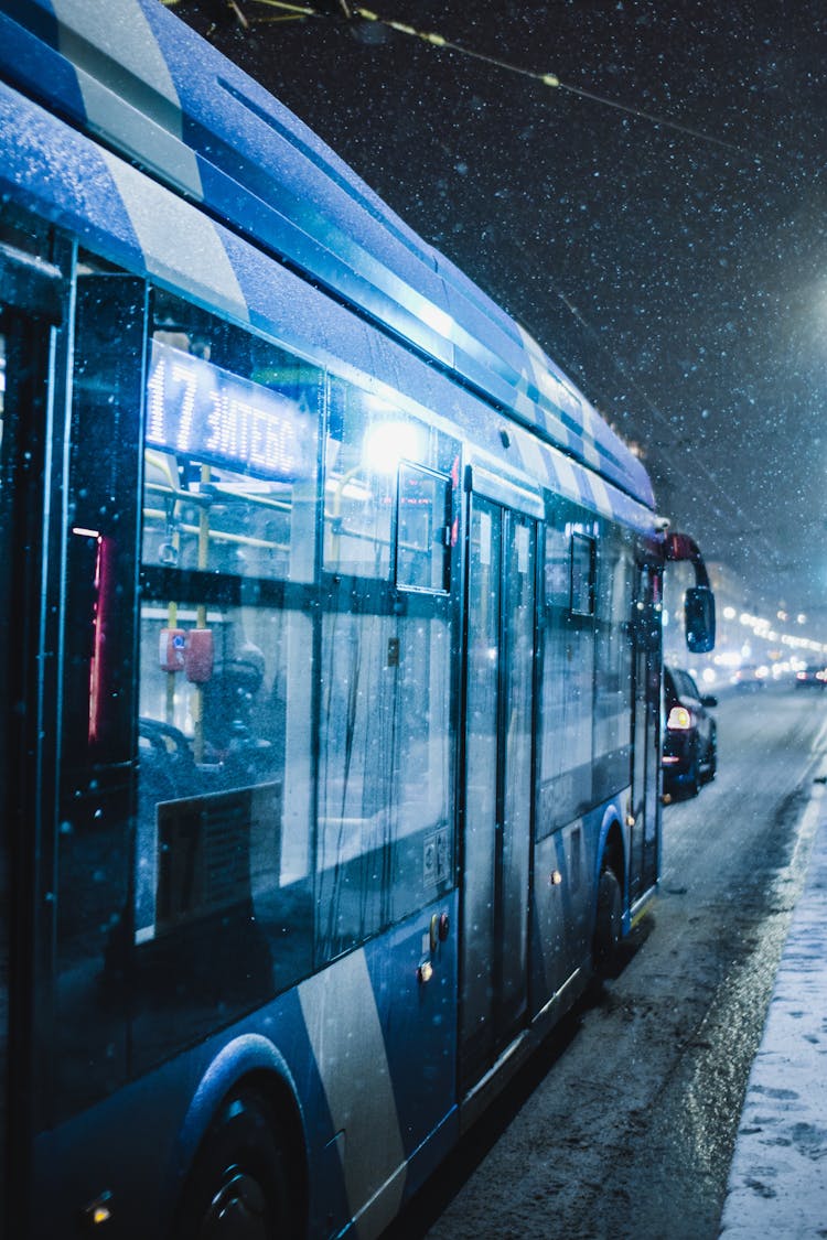 Blue Bus Driving In Snowy Weather 