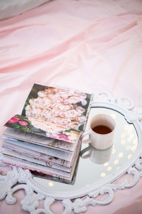 Free Cup of Tea and Magazine on Top of a Mirror  Stock Photo