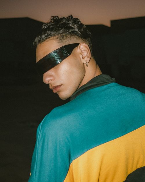 Free Stylish model wearing futuristic sunglasses posing outdoors in Fez, Morocco. Stock Photo