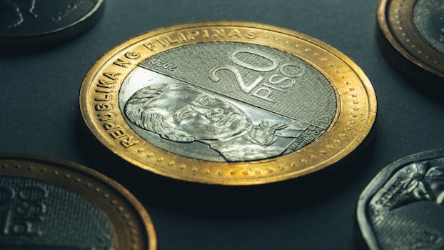 Detailed shot of a 20 peso coin from the Philippines highlighting its design.