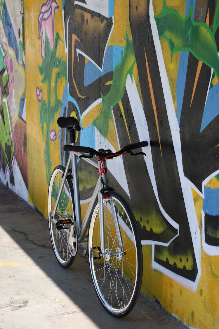 Bike Leaning On Wall With Graffiti