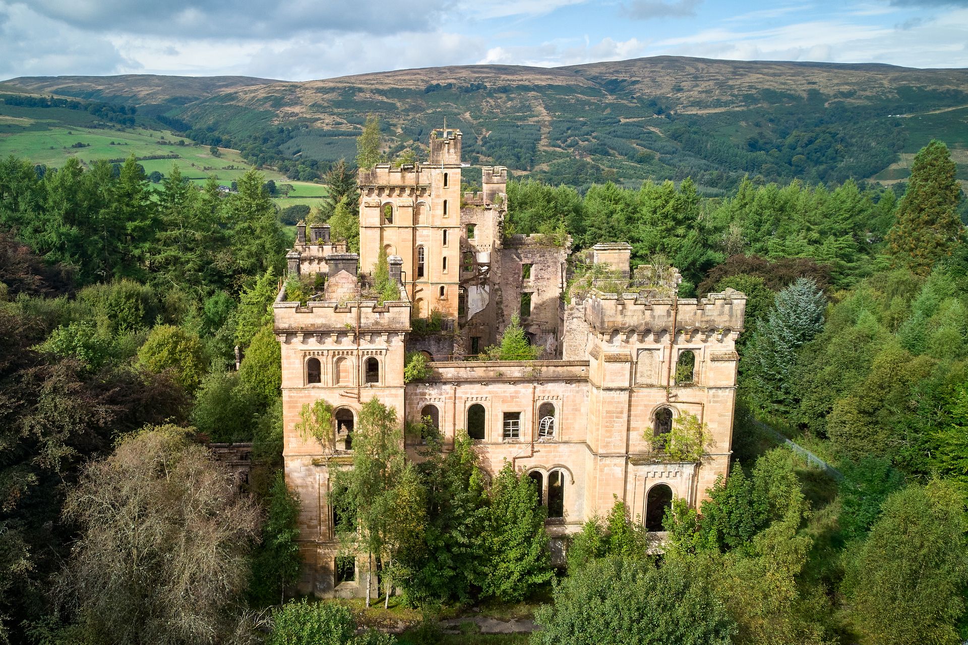 Explore the ruins of a medieval castle surrounded by Scottish highlands in Lennoxtown.