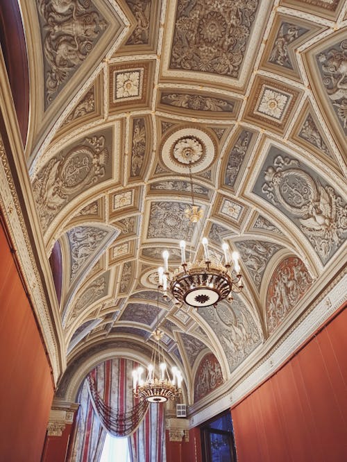 White and Brown Ceiling With Chandelier