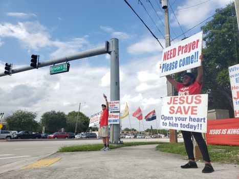 A Woman Holding a Poster