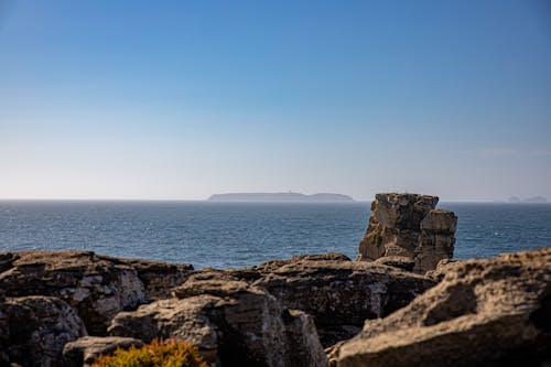 Rock Formations Near Body of Water