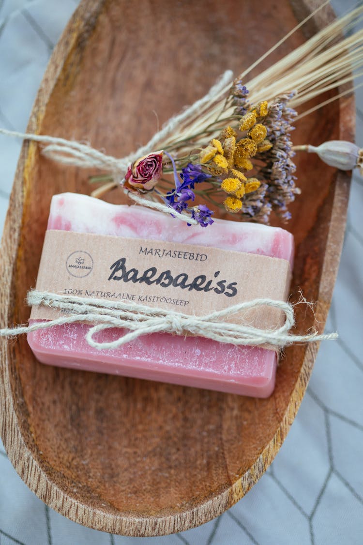 Close-Up Shot Of An Organic Bar Soap On A Wooden Tray