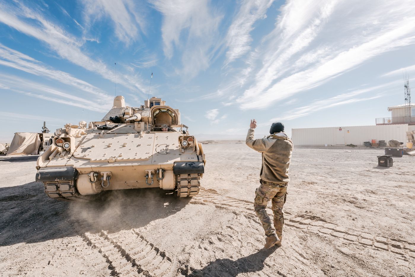 Armoured land defence vehicle deployed in a desert training environment