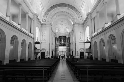 Free Grayscale Photo of People Walking Near the Altar Stock Photo