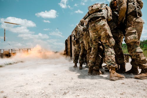 Soldiers Taking Cover during an Explosion