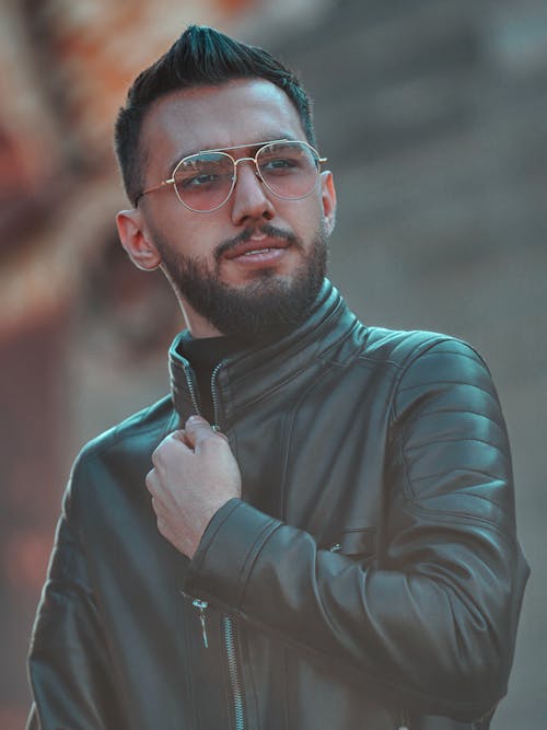 Free A Handsome Man in Black Leather Jacket Wearing Sunglasses Stock Photo