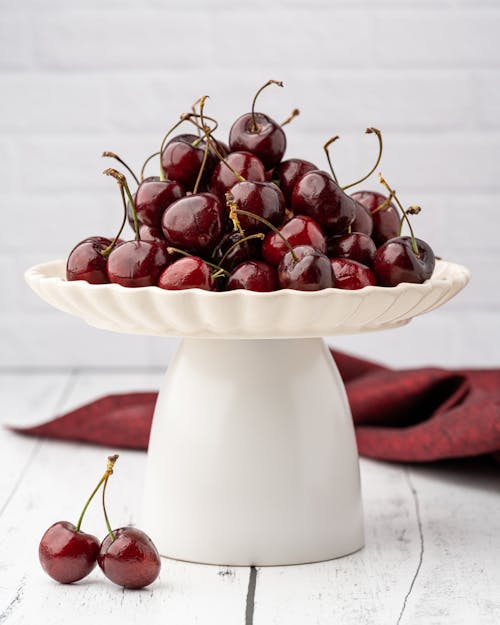 Red Cherries on White Fruit Holder