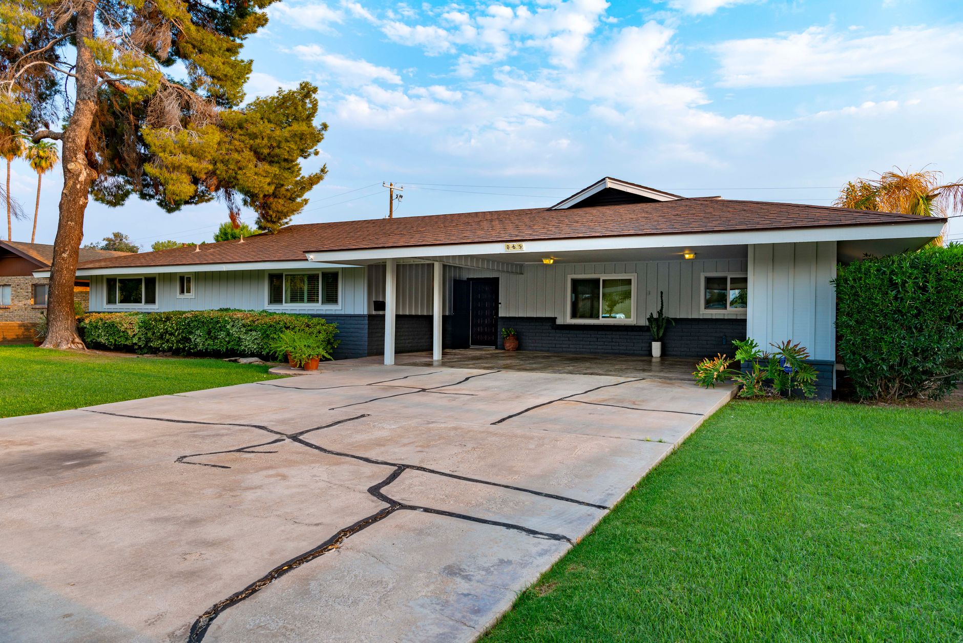 Elegant suburban bungalow with well-manicured lawn — California residential home — chimney services in Modesto, California