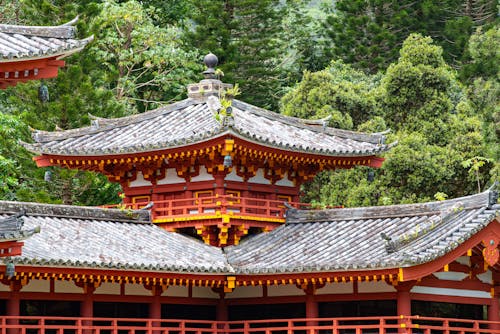 Free Red Temple Near Green Trees Stock Photo