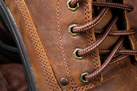 Detailed close-up of brown leather shoe with focus on shoelace and stitching.