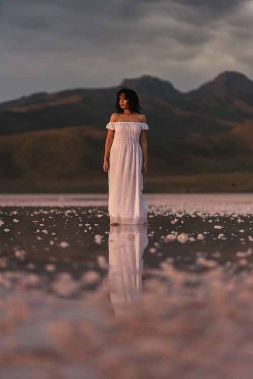 A Woman in White Dress Standing on the Beach · Free Stock Photo
