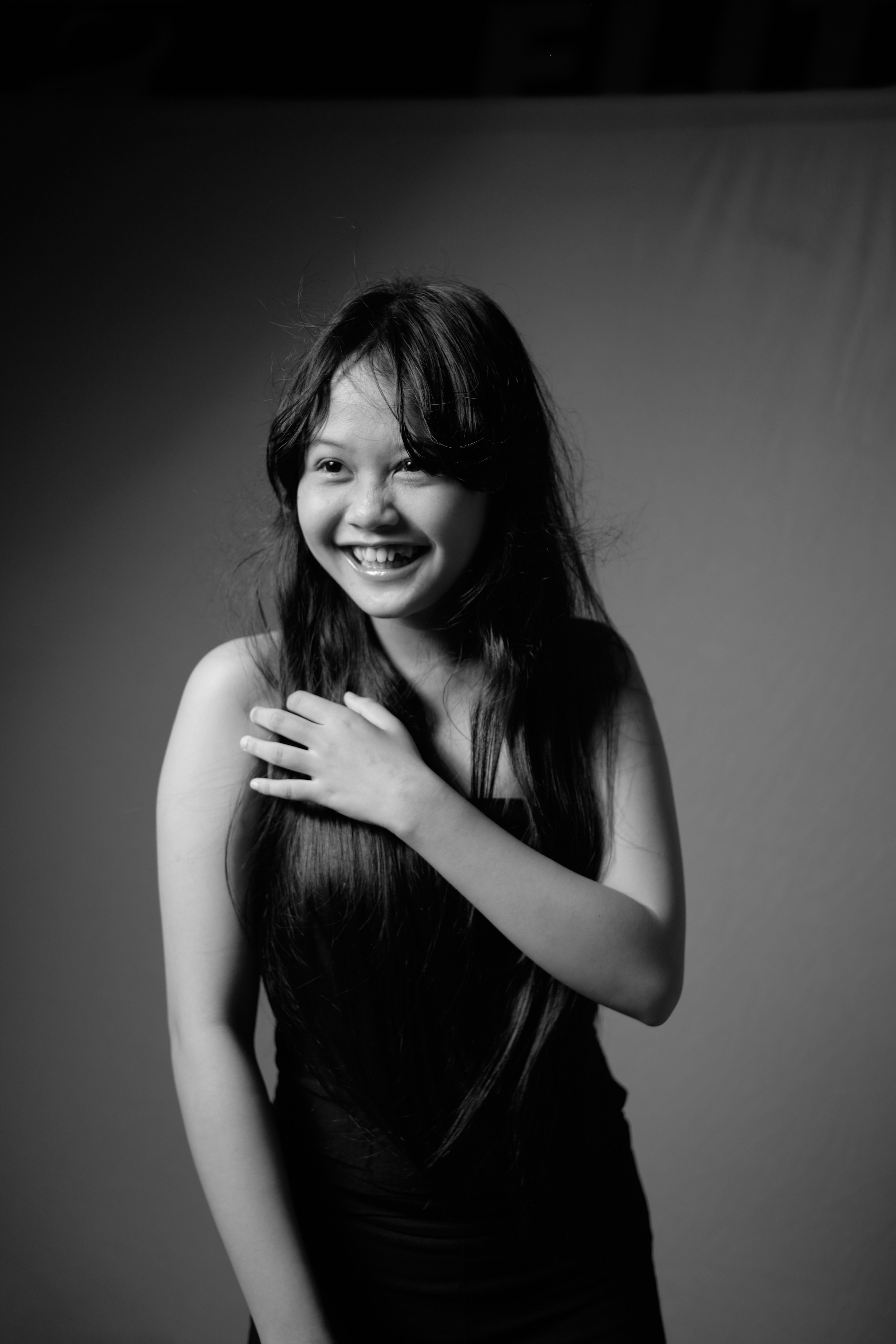 Black and White Photo of a Girl Smiling · Free Stock Photo