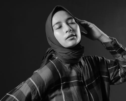 Grayscale Photo of a Woman in Hijab Posing