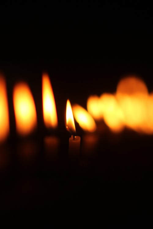 Close Up Photo of a Lighted Candle