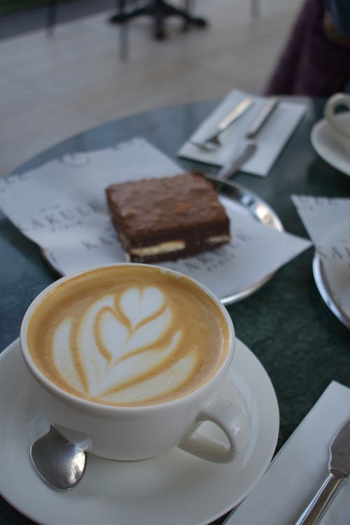 Close-Up Shot of a Cup of Cappuccino on a Saucer