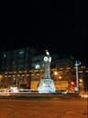 A Monument in the Middle of the Road During Night Time