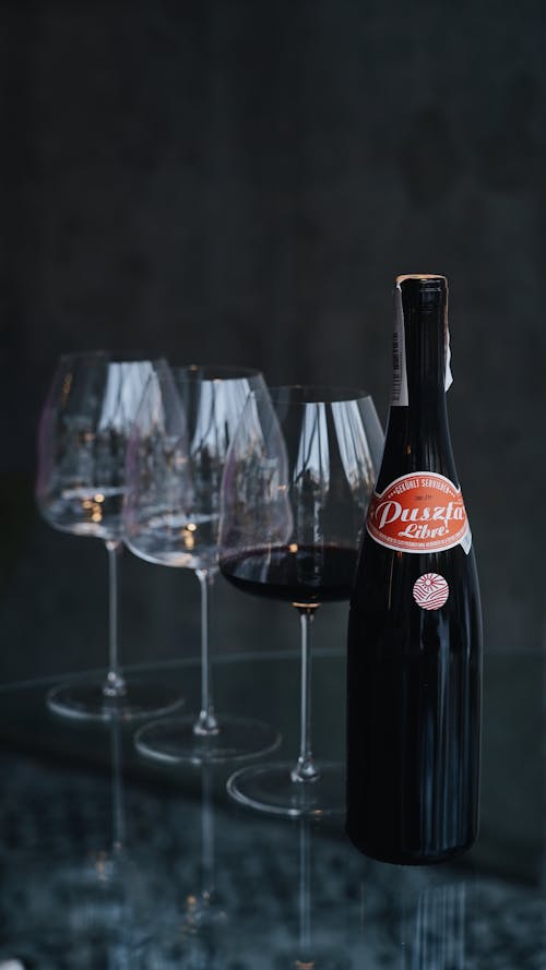 Free A Bottle of Red Wine and Wine Glasses Stock Photo