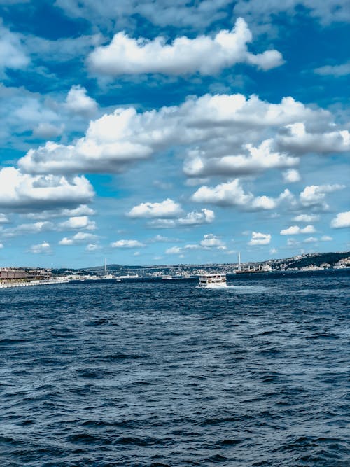 A White Ferry Boat Sailing on the Sea