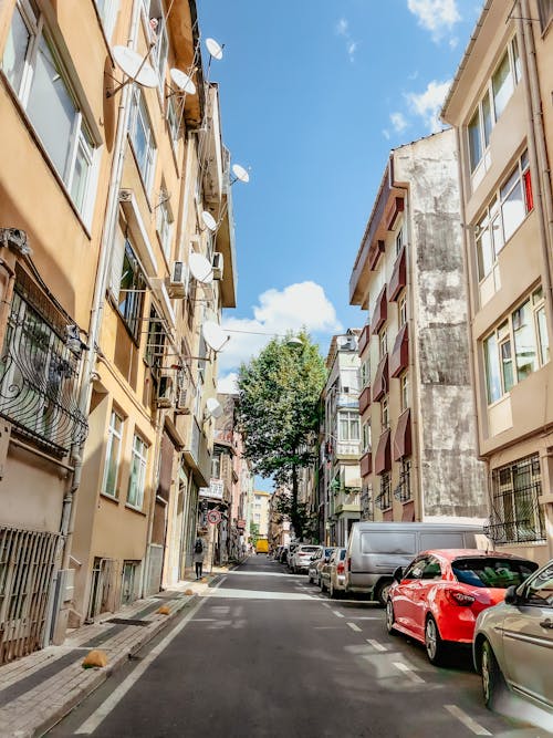 Cars Parked in a Street with Buildings