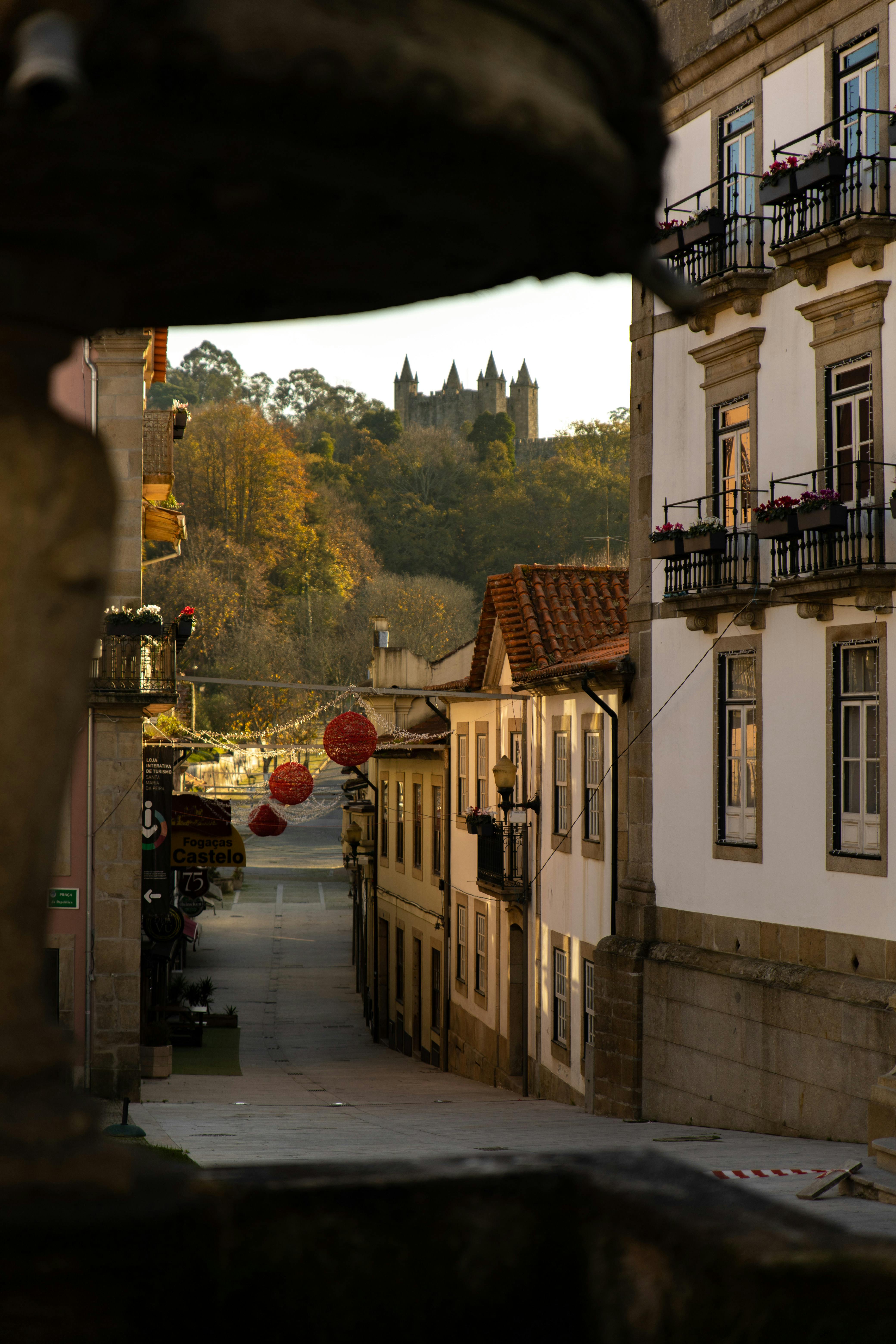 an empty street between buildings