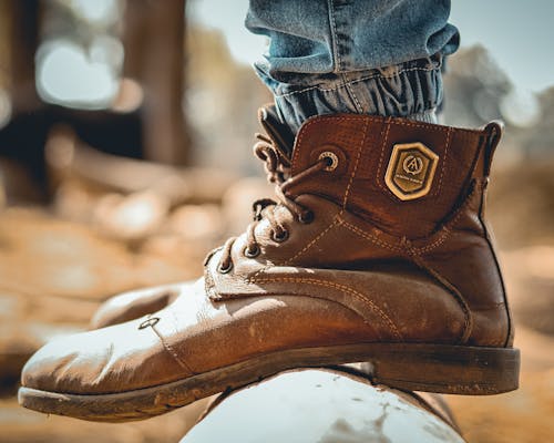 Person Wearing Brown Leather Work Boots