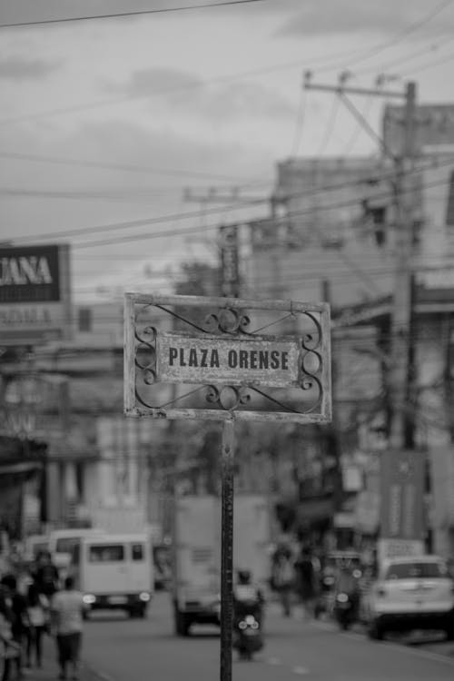 Grayscale Photo of a Street Sign 