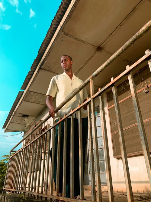 Free Man Standing at the Balcony Stock Photo