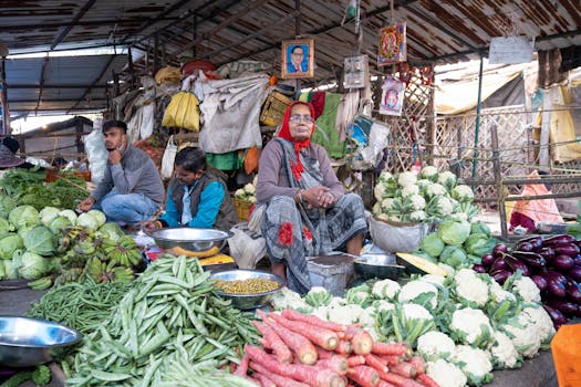 Vibrant outdoor market with fresh vegetables and local vendors, showcasing daily life.