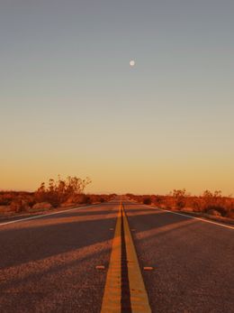 Empty desert highway at sunset, photo by Ikaia Pal on Pexels