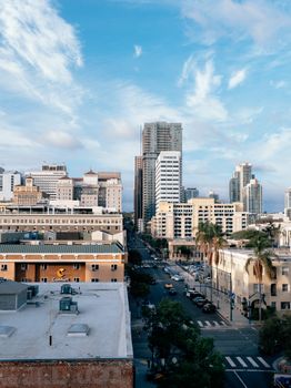 High angle view of San Diego's bustling downtown with skyscrapers under a bright sky.