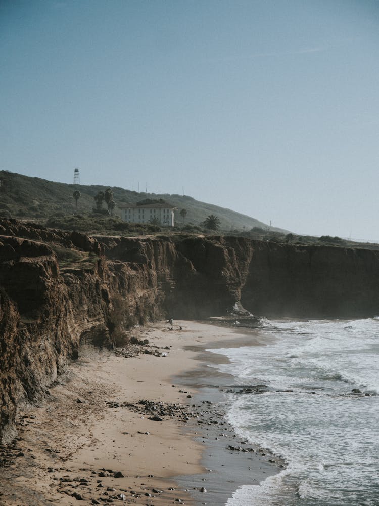 Sea, Beach And House On Cliff