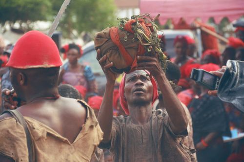 Free A cultural event in Ghana featuring a traditional ritual with people gathered in vibrant attire. Stock Photo