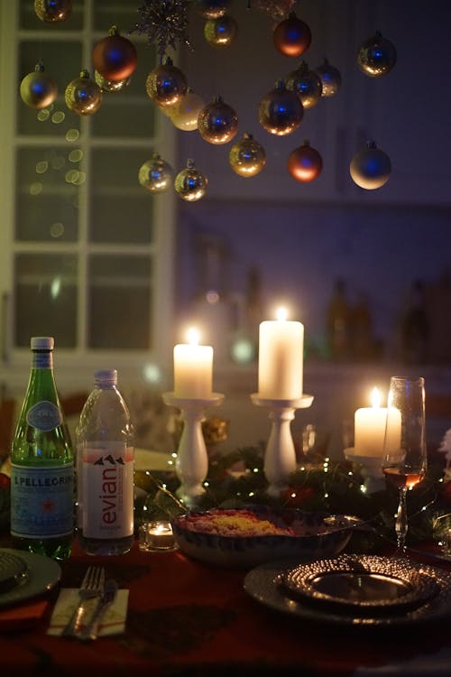 Lighted Candles on a Dining Table