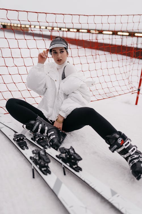 Woman Putting on Skis