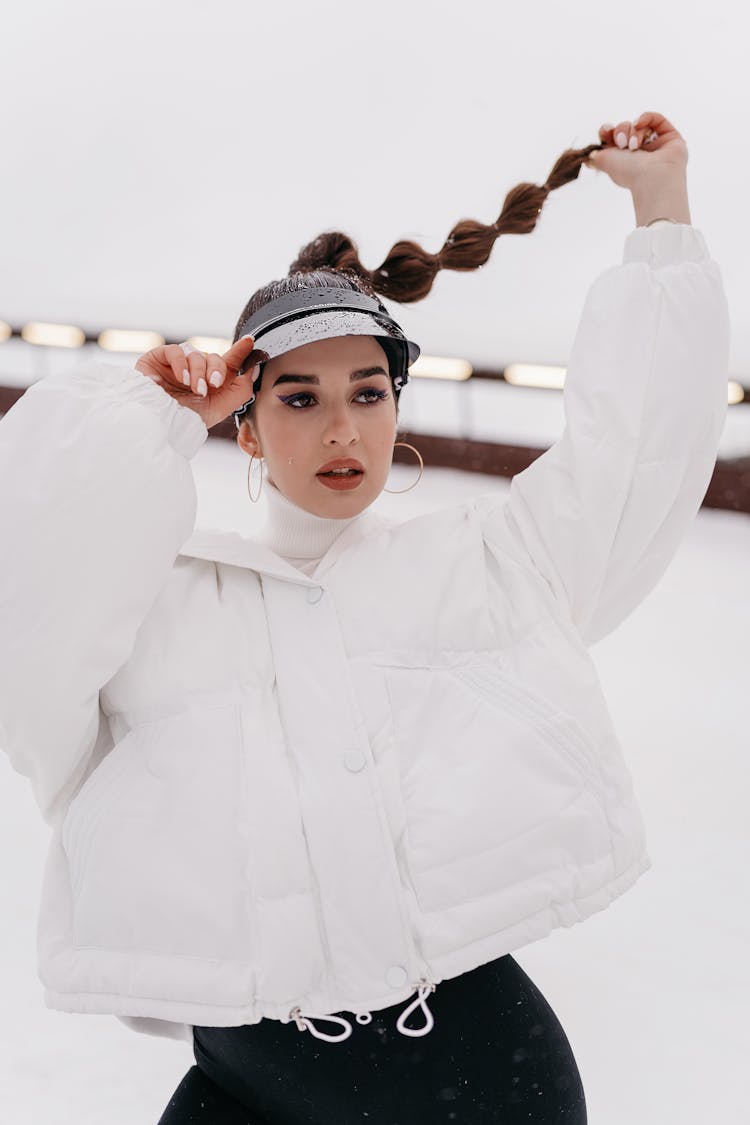 Woman In Sports Clothing Holding Her Braid