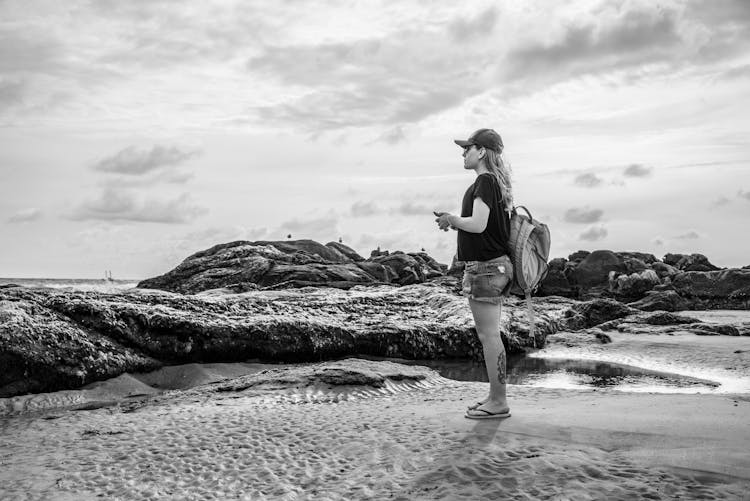 Woman Standing Among Rocks