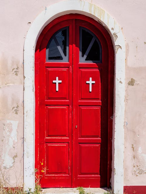 Red Wooden Door on White Concrete Wall