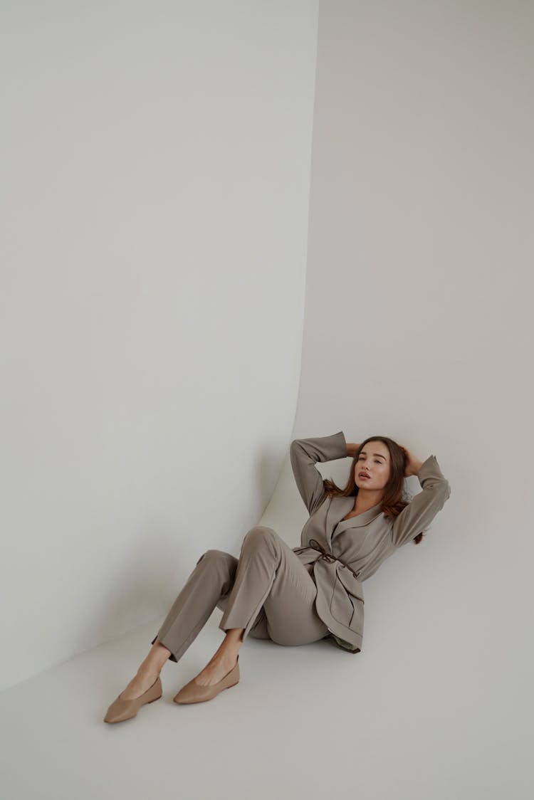 Girl Wearing Elegant Clothes And Laying On A Floor