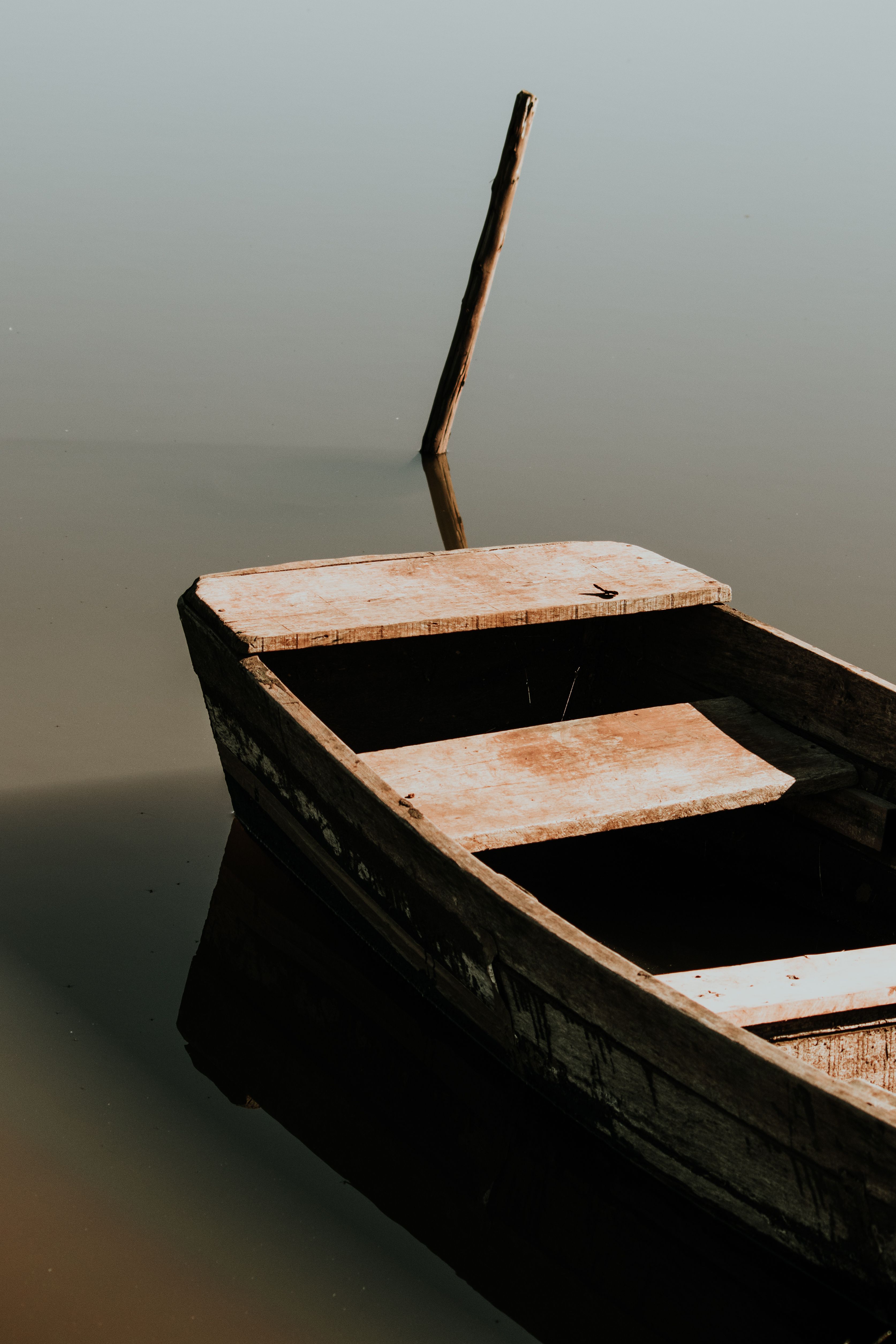 Wooden Boat Anchored on Body of Water · Free Stock Photo