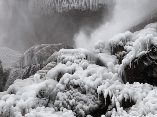 Ice Formations at Waterfall in Winter 